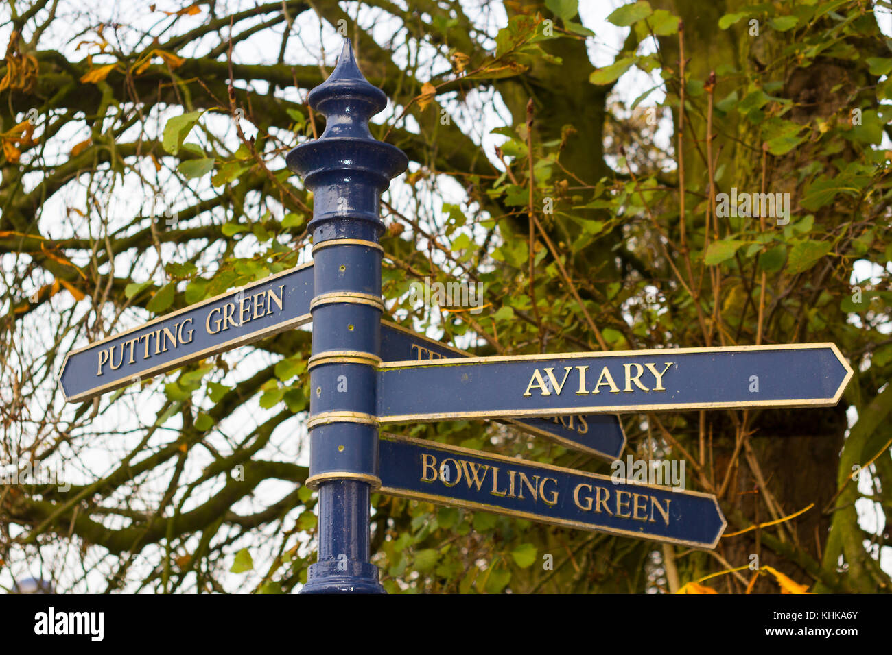 A typical cast iron finger post sign in the towns colours located in the heart of Ward Park in Bangor County Down in Northern Ireland Stock Photo