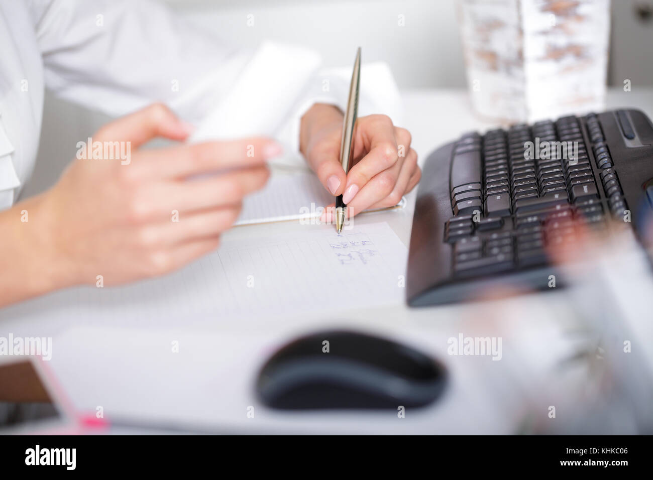 business woman hand writing on paper Stock Photo - Alamy