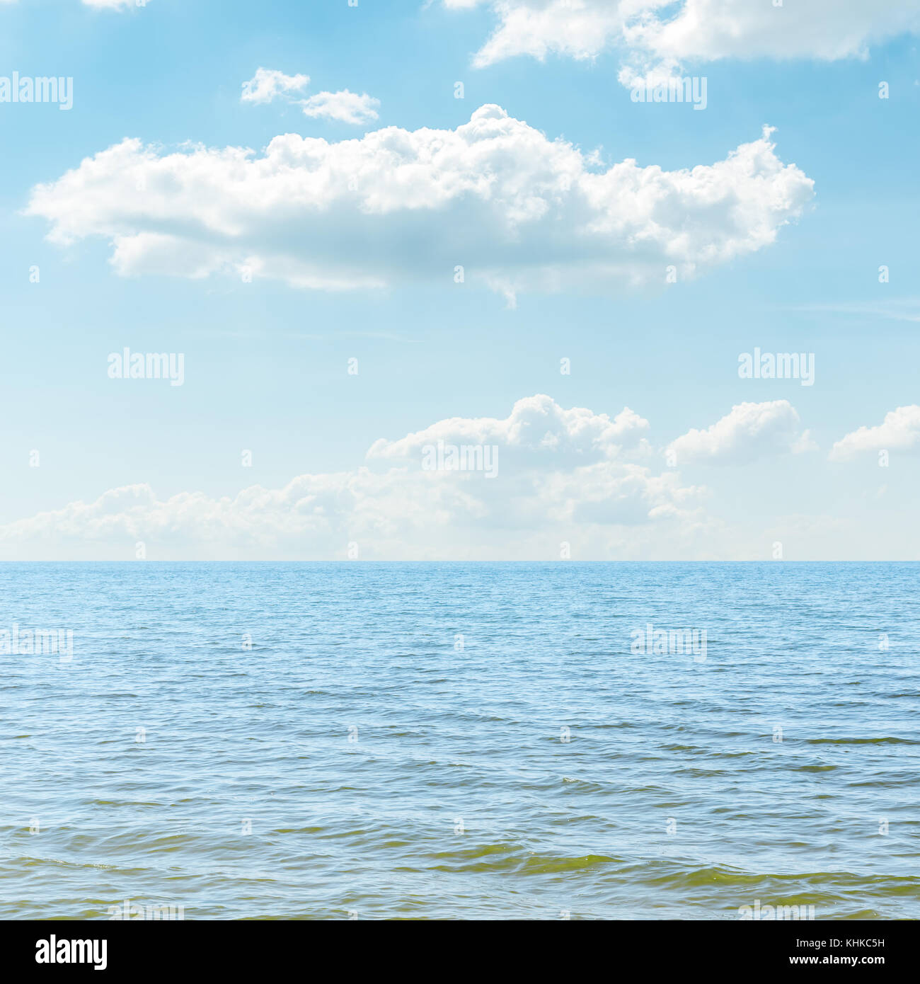 blue sea and cloudy sky over it Stock Photo - Alamy