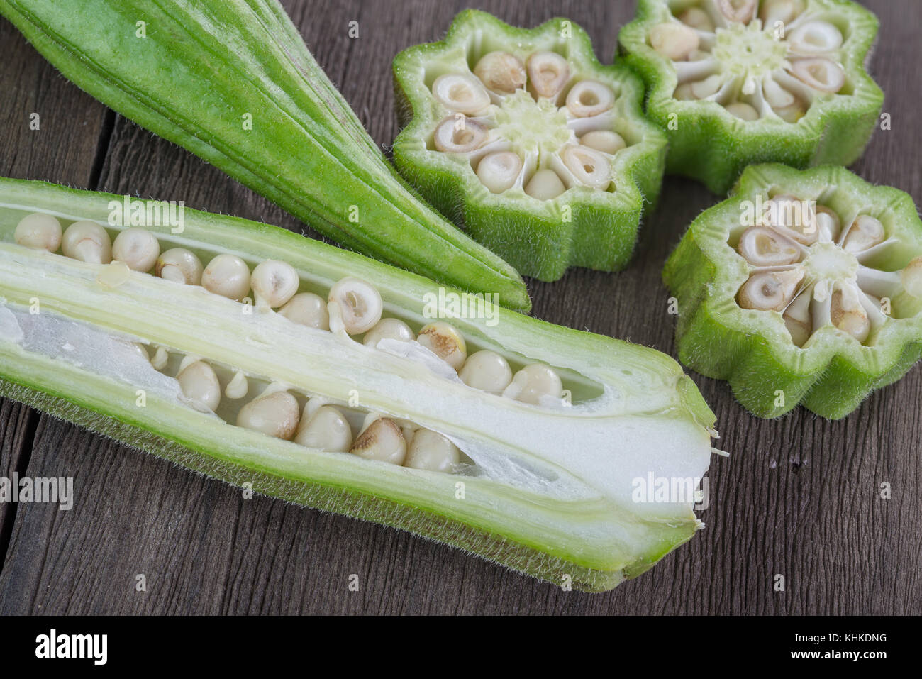 fresh  okra  vegetable also known as  lady's fingers on old wooden background Stock Photo