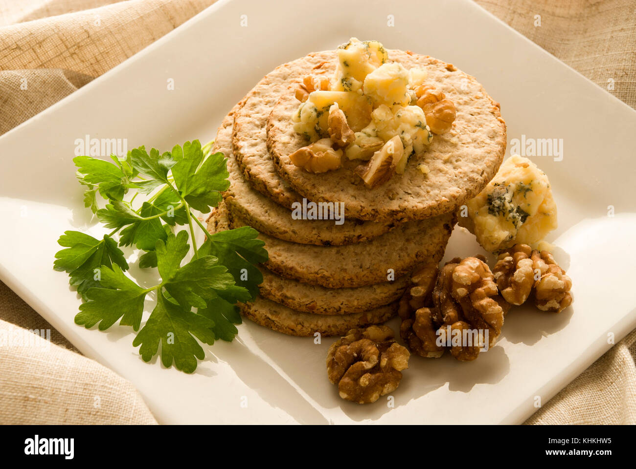 Oat biscuits with Blue Stilton Cheese and walnuts. Stock Photo