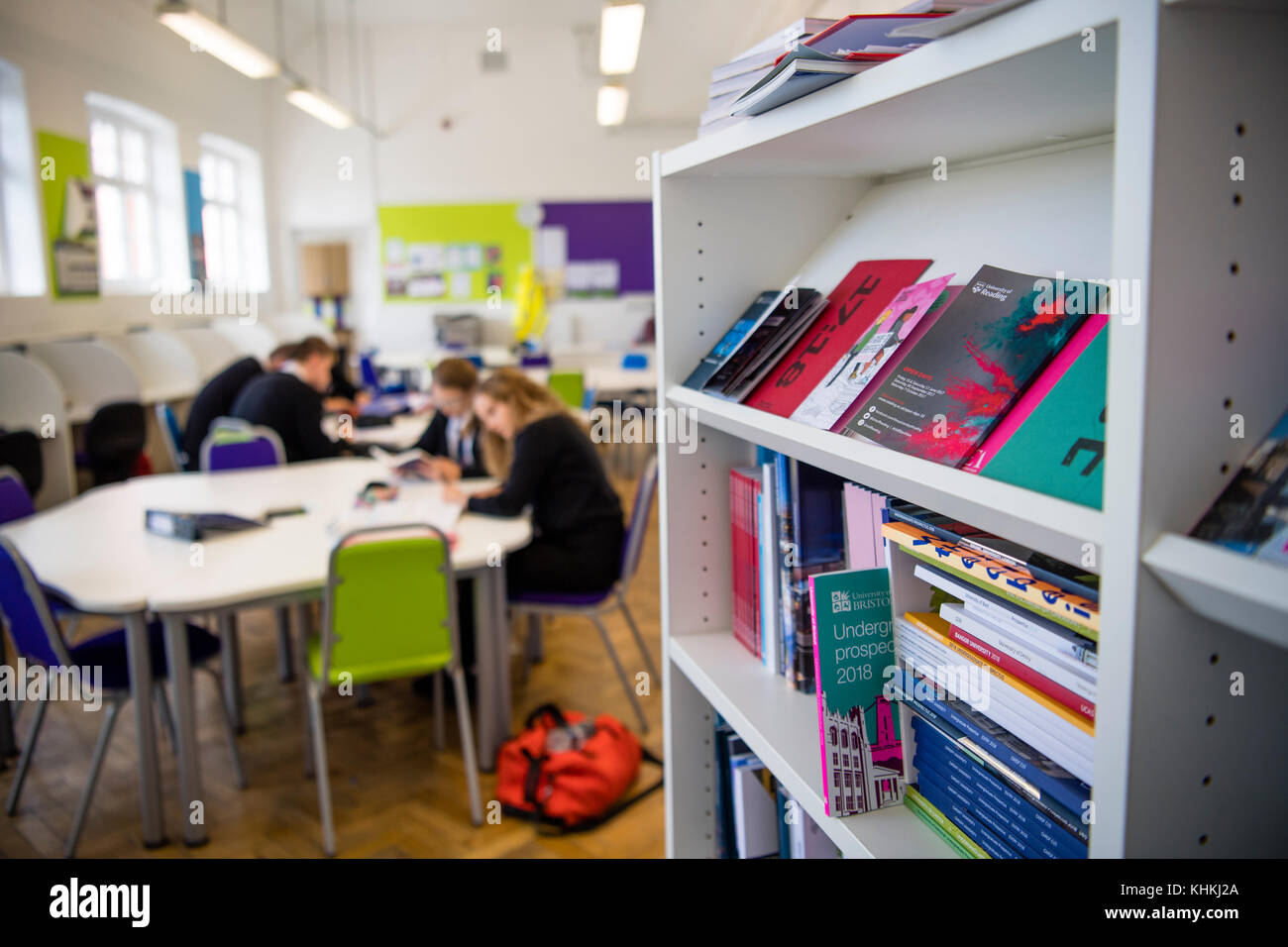 Secondary Education in the UK: University propectuses on a bookshelf in a sixth form common room Stock Photo