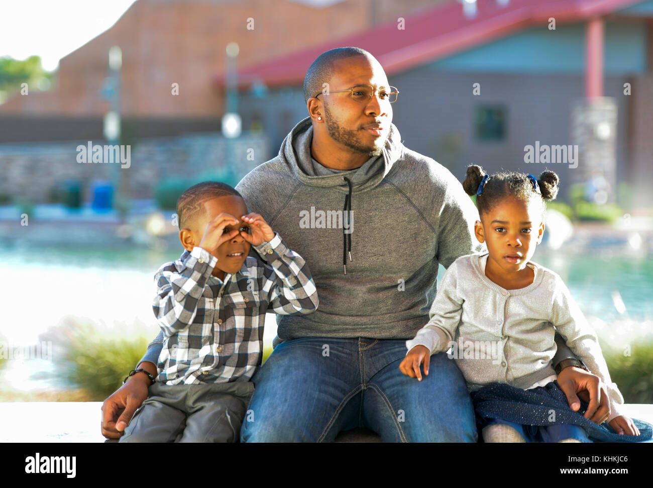 African American Man with son and daughter in a park. Stock Photo
