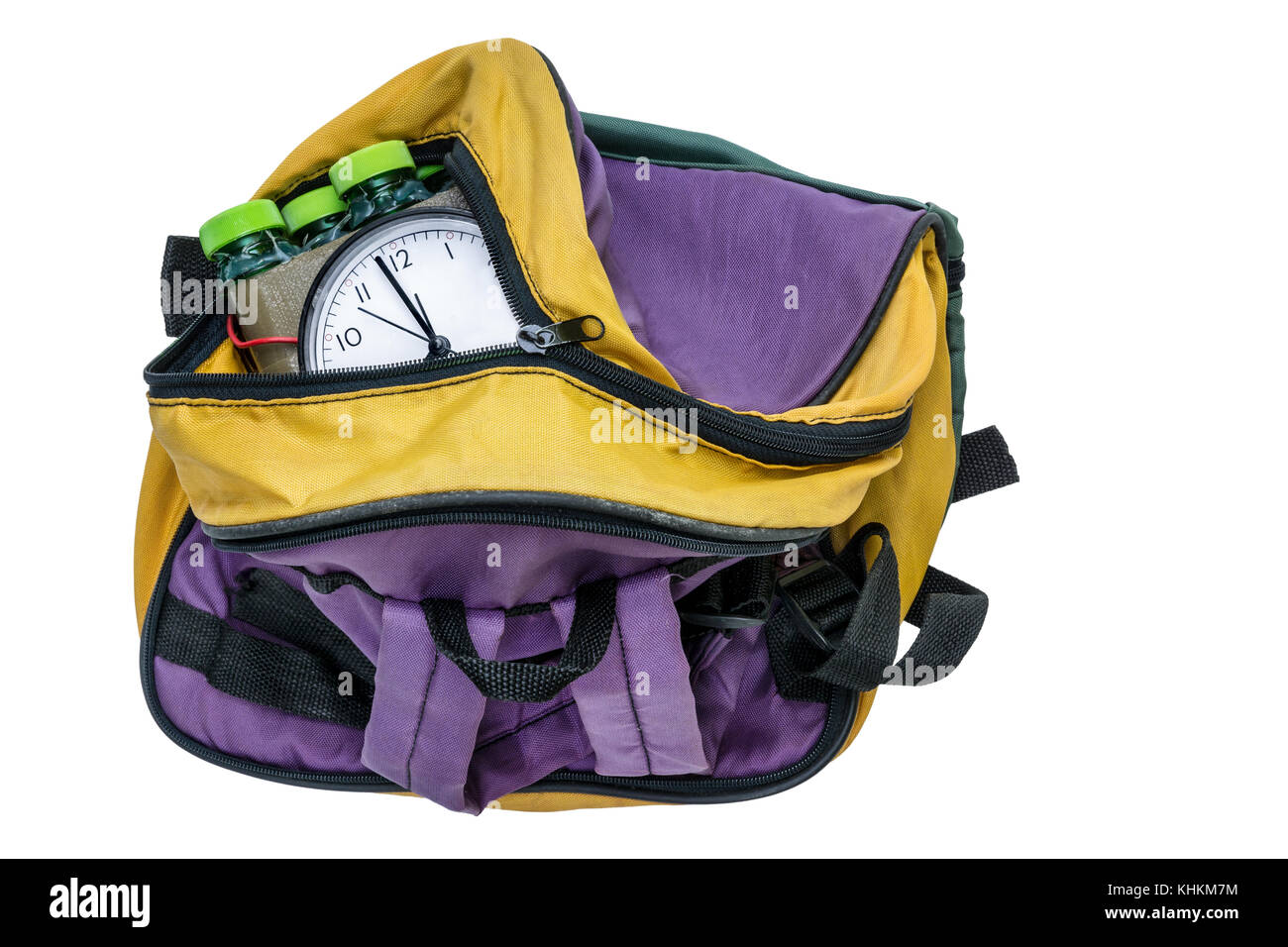 Timed bomb in colored bag. Imitation of time bomb inside the bagpack on white background. Isolated. Stock Photo