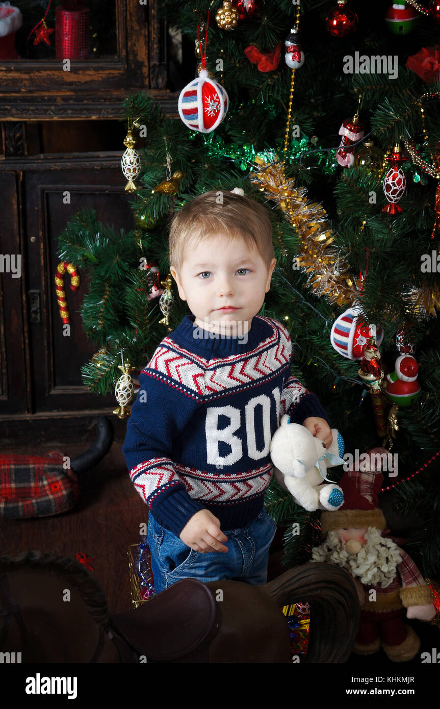Beautiful little kid posing in front of the new year.Isolated studio