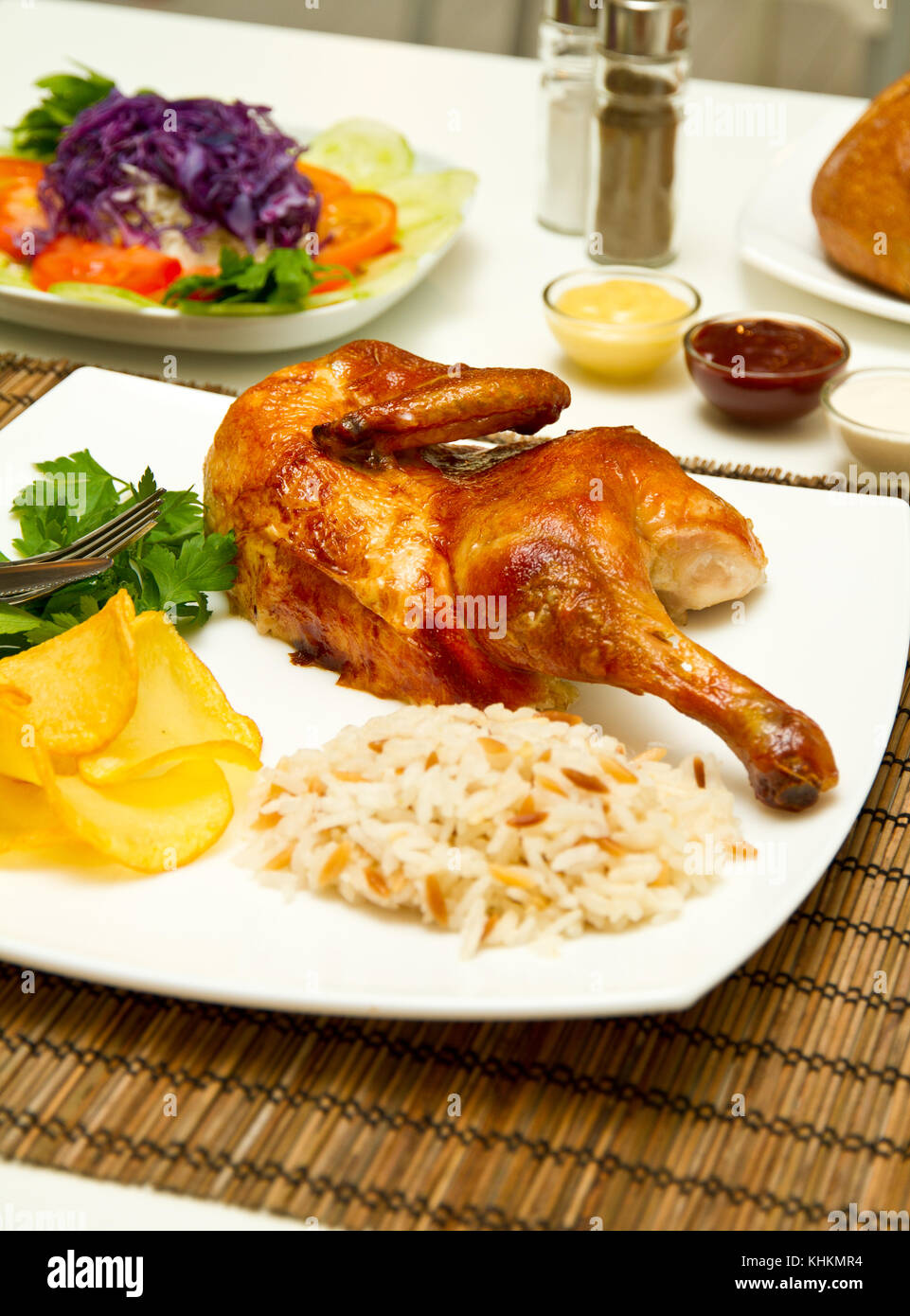Charcoal baked chicken and side dishes Stock Photo