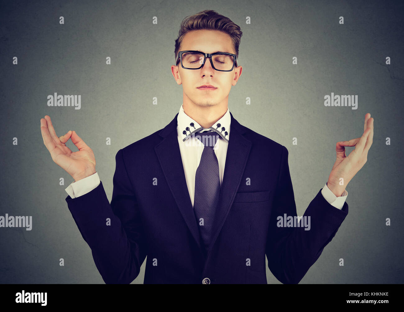 Business man meditating relaxing with eyes closed Stock Photo