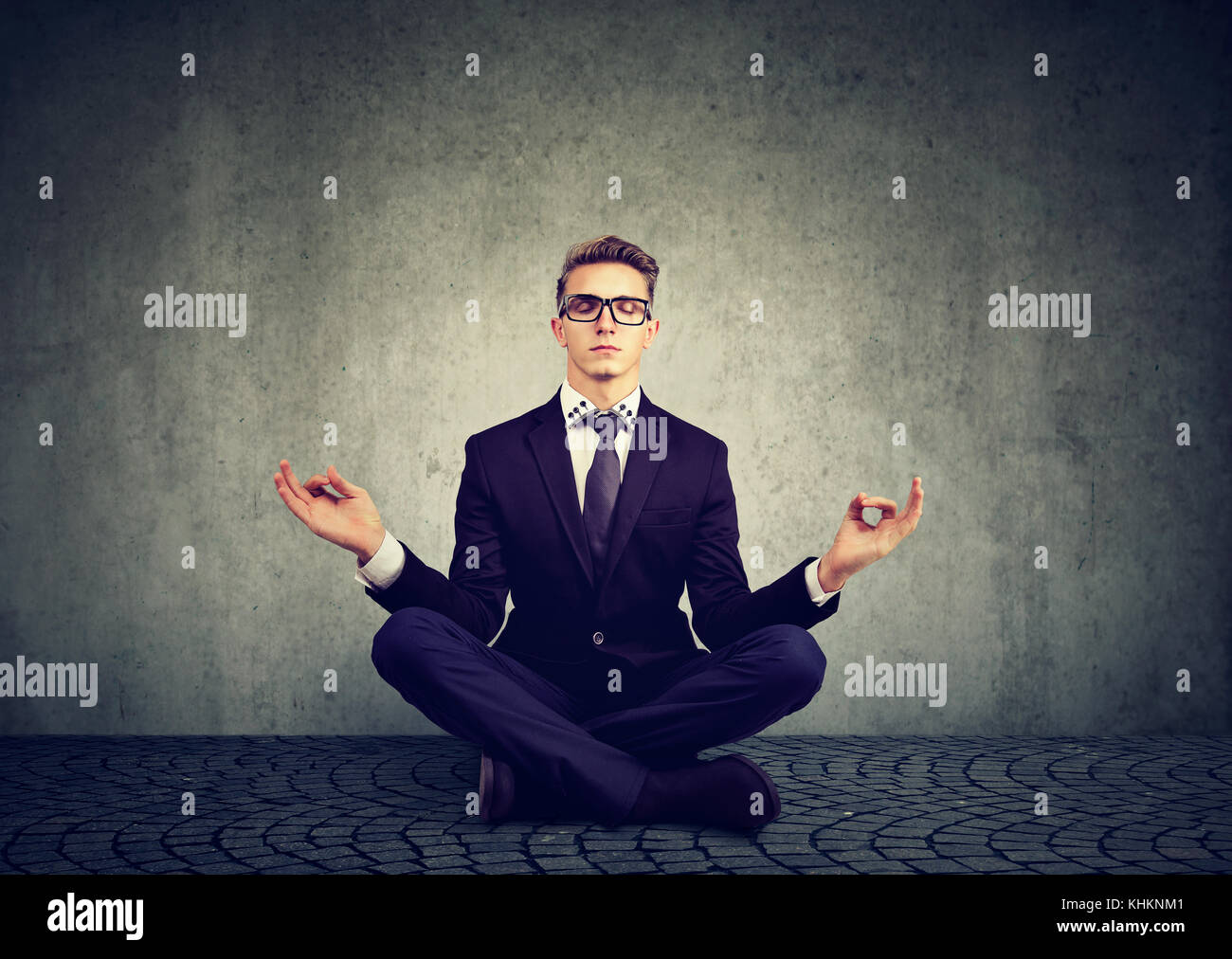 Business man meditating relaxing with eyes closed Stock Photo
