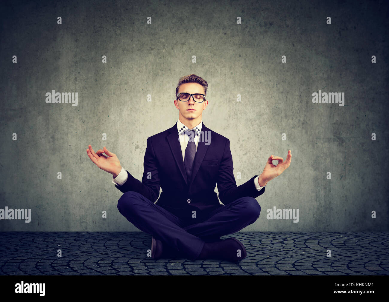 Business man meditating relaxing with eyes closed Stock Photo - Alamy