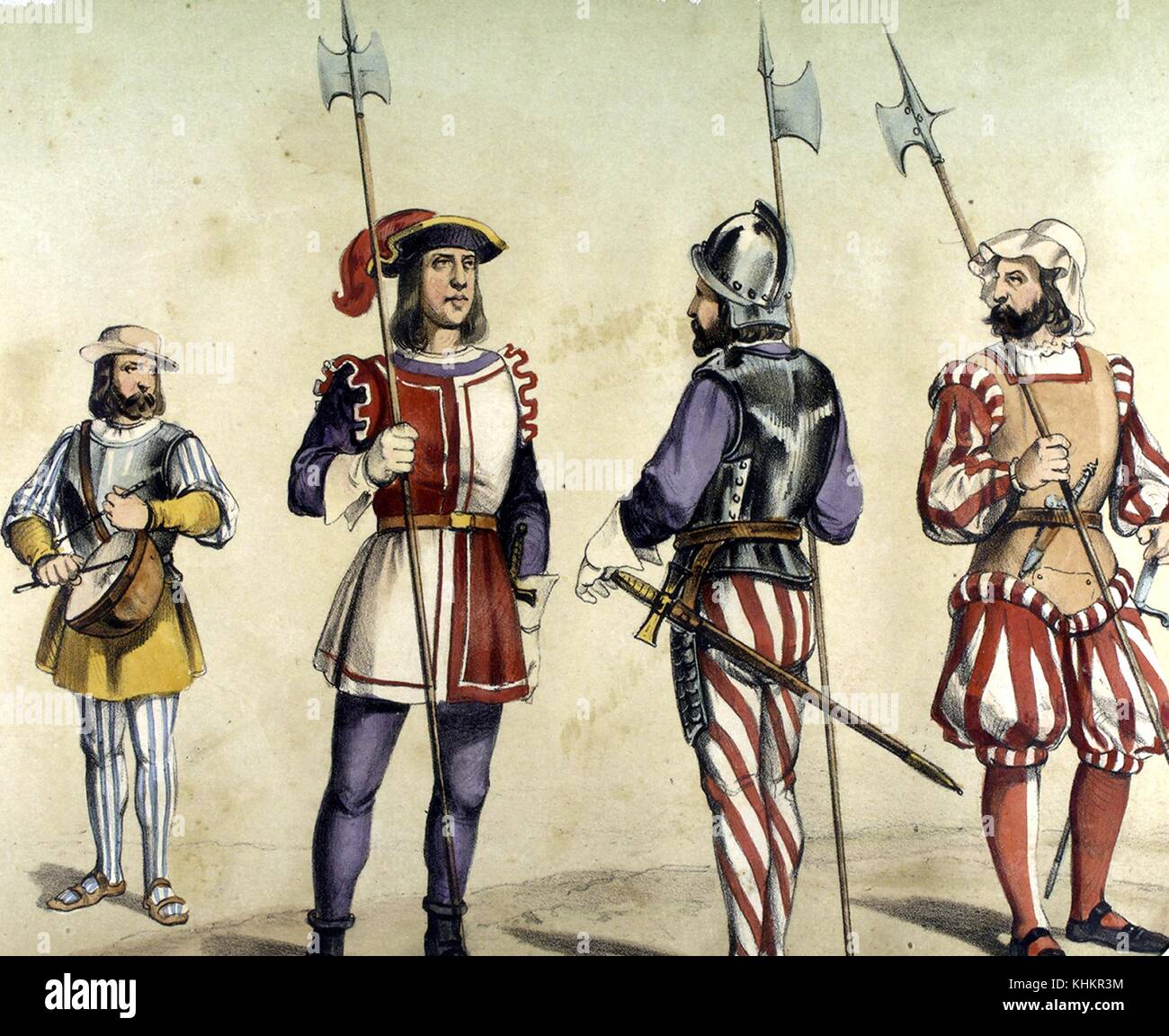 A color lithograph depicting four different classes of soldiers as they would have appeared in 1496, the three soldiers on the left are Spanish, the soldier on the left plays a kettledrum and wears chest armor, the second soldier wearing a red and white tunic is a guard, the third soldier is a Beefeater charged with guarding the king on any of his expeditions, the soldier on the right is a German mercenary who would have been fighting for the Spanish at this time, 1861. From the New York Public Library. Stock Photo