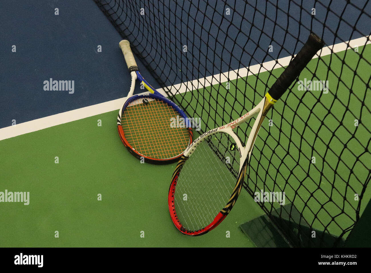 Two Tennis Rackets near Net on Playground Court. Sport Background Stock