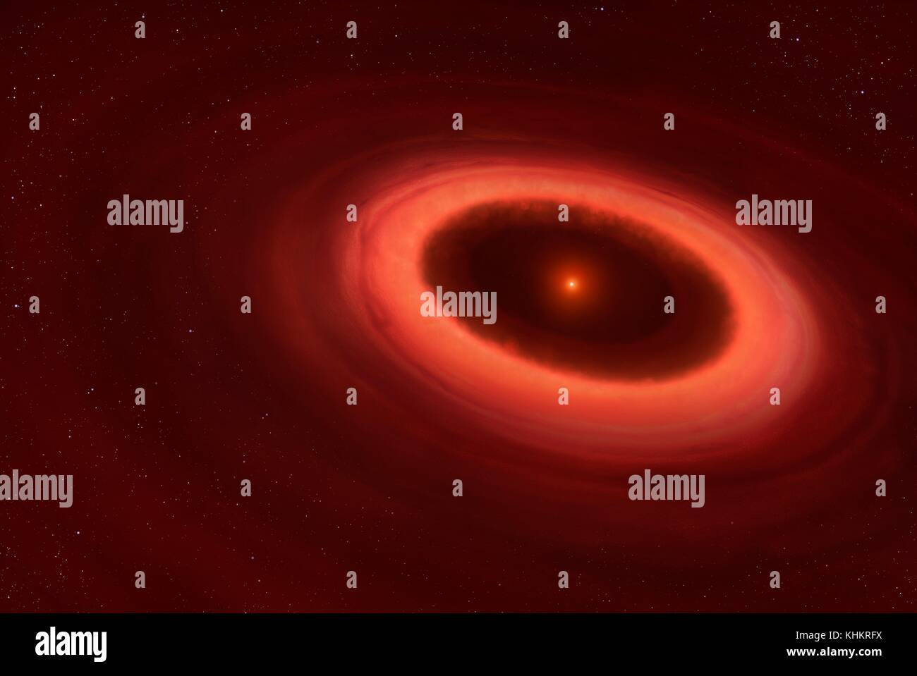 Disc around Proxima Centauri,illustration.The closest star to the Sun,Proxima Centauri,has been found to harbour a belt of dust.Astronomers using the Atacama Large Millimeter/submillimeter Array (ALMA) in Chile detected emissions from a dust belt around the small star.It is similar to the asteroid belt in our own solar system,with particles ranging in size from sub-millimetre dust to asteroids kilometers across.The belt of cool dust is one to four times as far from Proxima Centauri as the Earth is from the sun. Stock Photo
