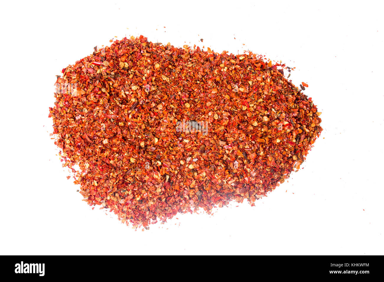 Red pepper powder on a pile isolated on white Stock Photo Alamy