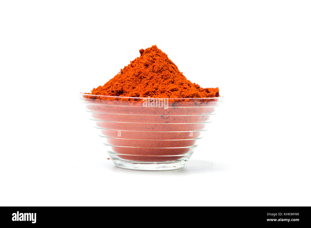Red pepper powder in a glass bowl isolated Stock Photo Alamy