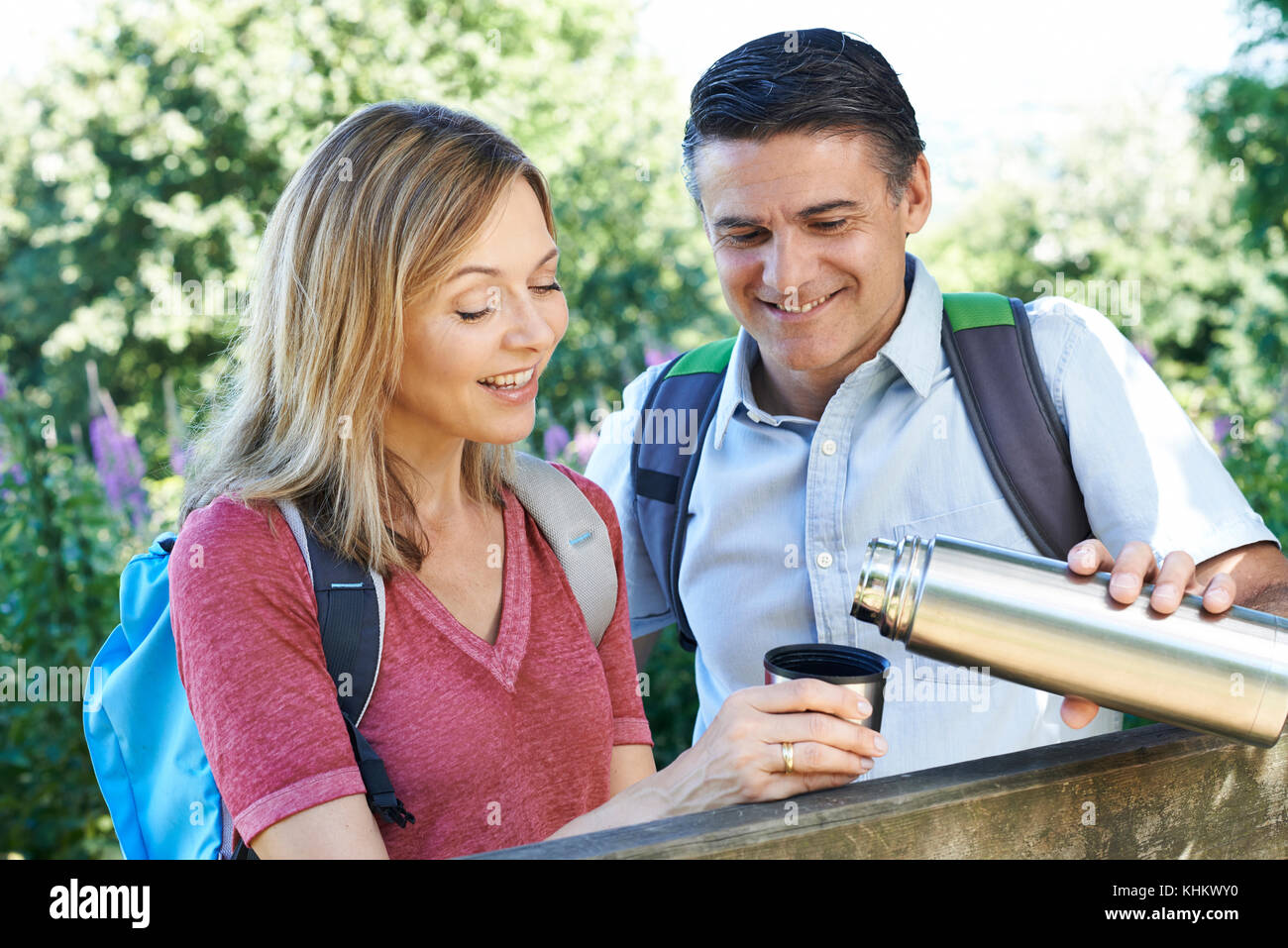 Mature Couple On Walk Drinking From Flask Stock Photo