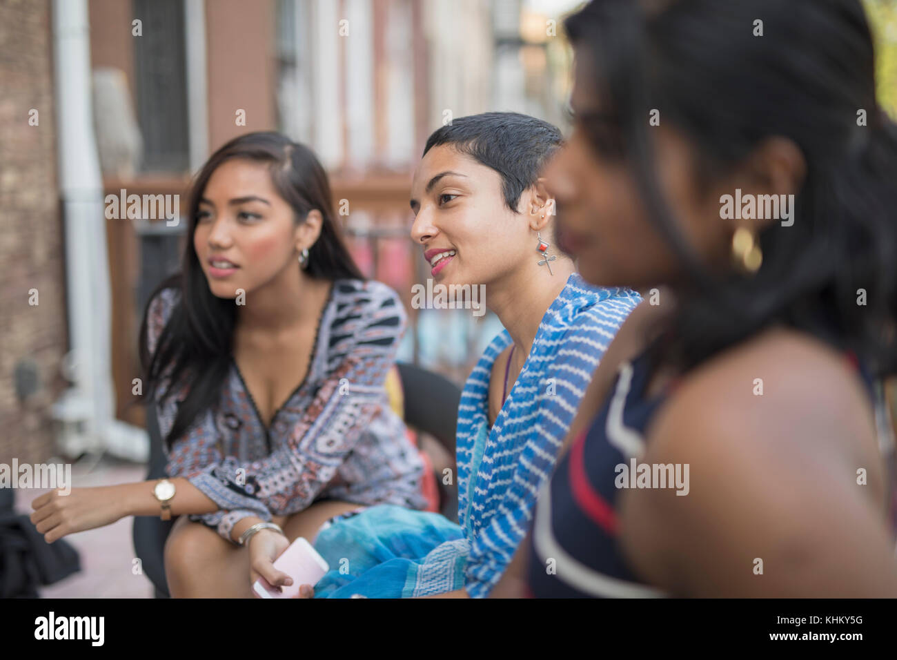 Young women talking at a party Stock Photo