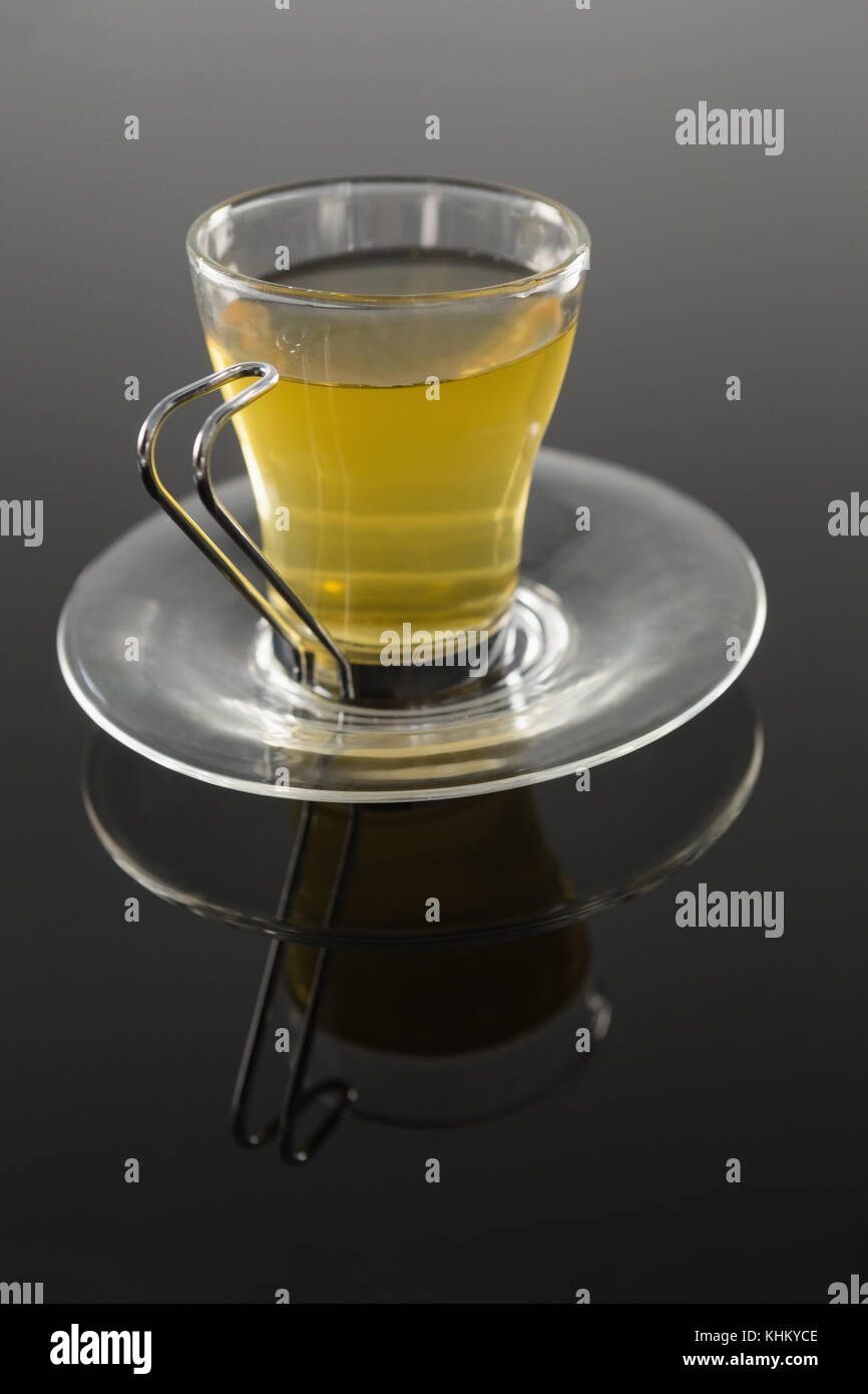 Cup of cinnamon tea on black background Stock Photo