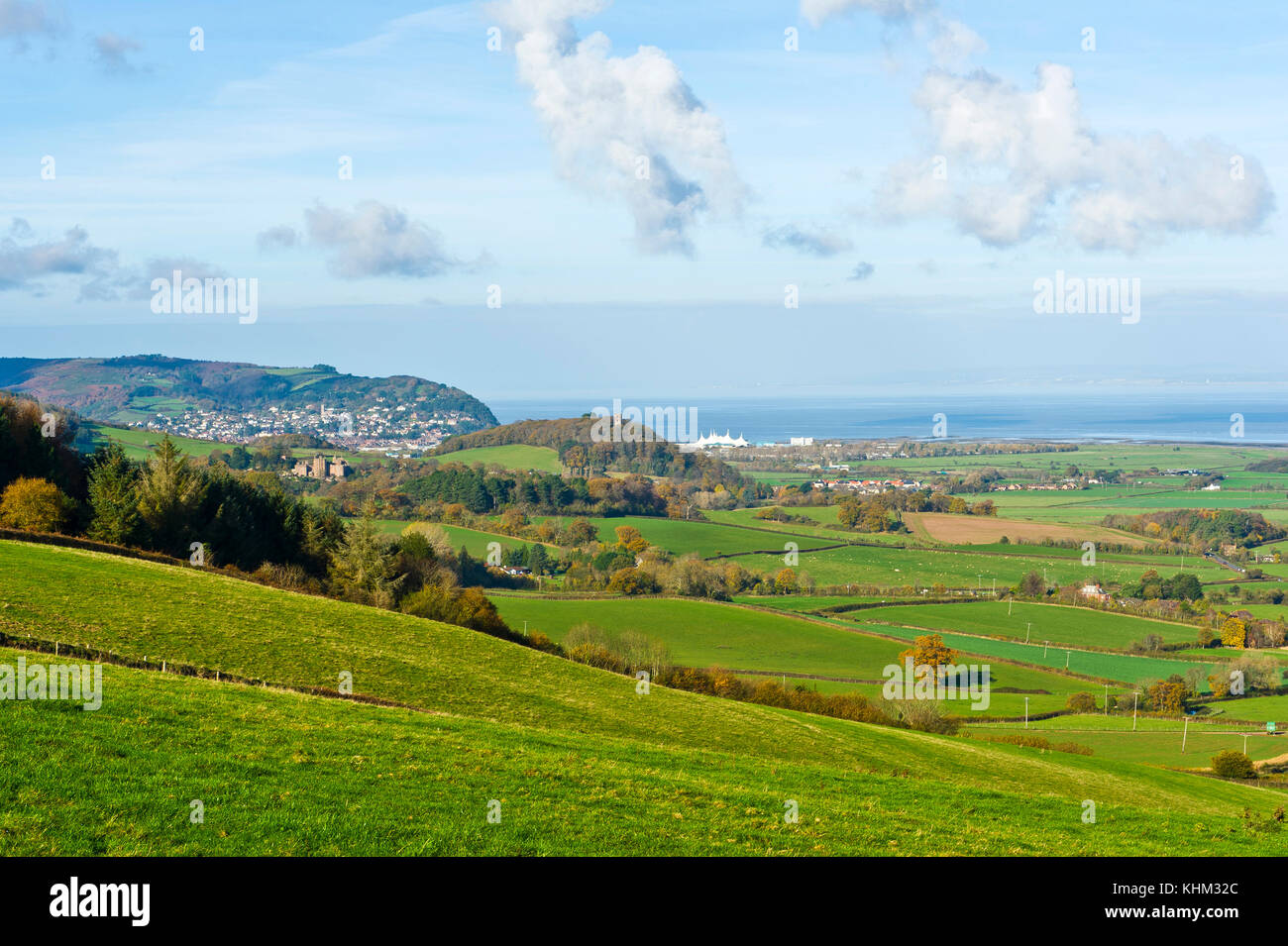 Dunster Castle and Minehead from Withycombe Hill,, Dunster, Somerset Stock Photo