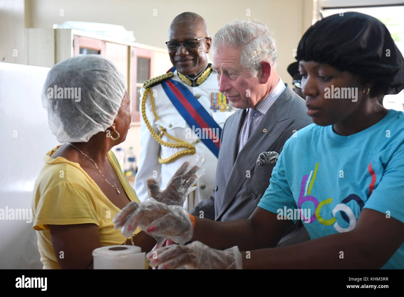 The Prince of Wales speaks to the cooks at the temporary shelter at the National Technical Training Centre in Antigua as his tour of hurricane-ravaged Caribbean islands began. Stock Photo