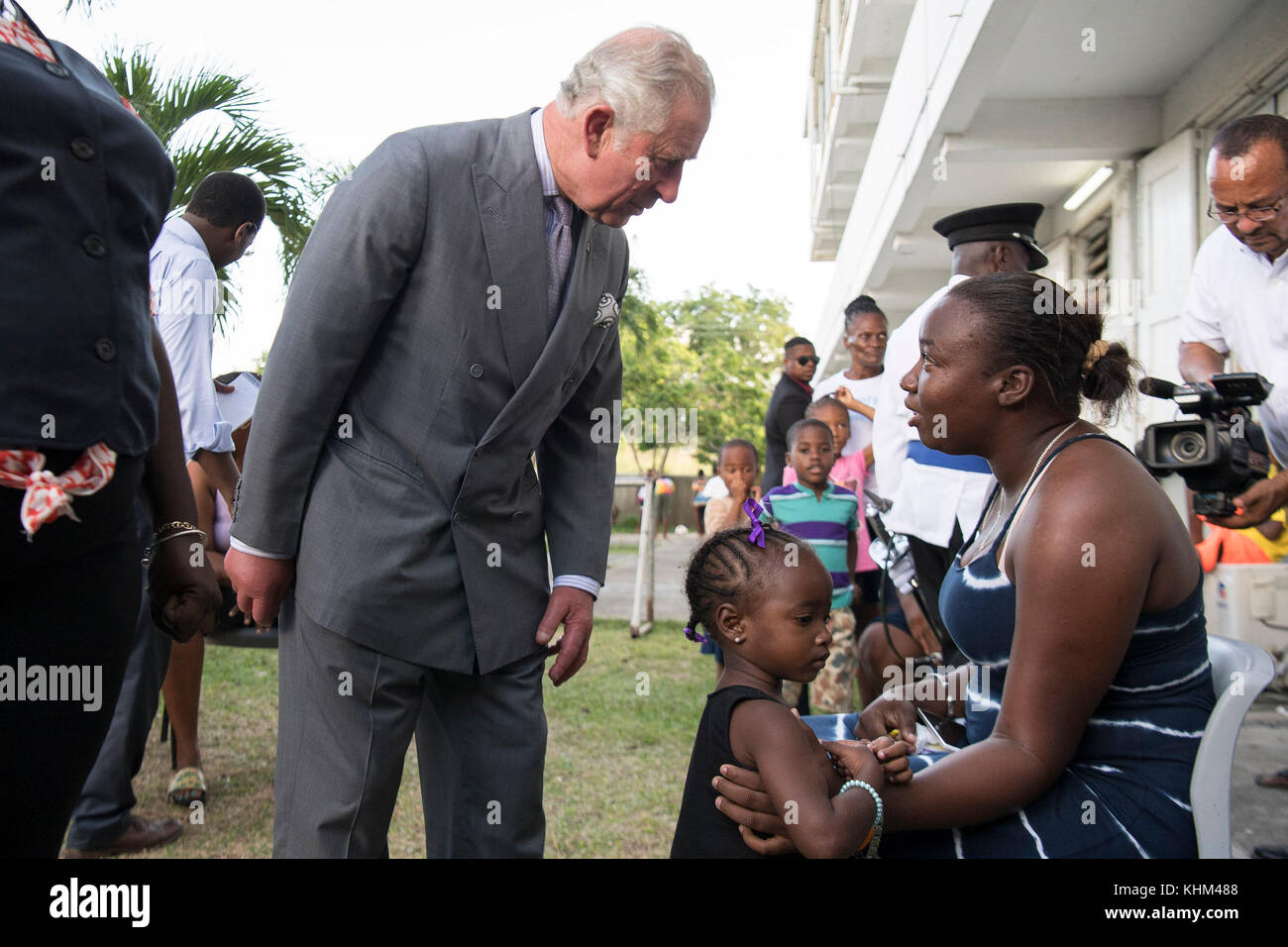 The Prince of Wales speaks to a resident at the temporary shelter at the National Technical Training Centre in Antigua as his tour of hurricane-ravaged Caribbean islands began. Stock Photo
