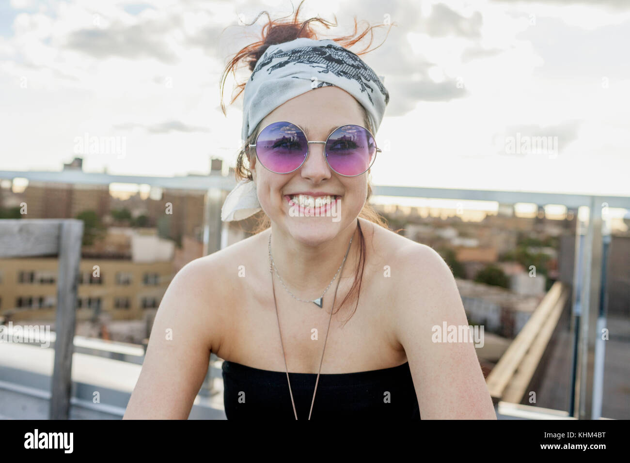 Portrait of a young woman wearing sunglasses Stock Photo - Alamy