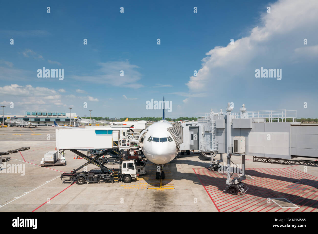 Airplane at airport terminal gate ready for takeoff. Modern international airport. Stock Photo