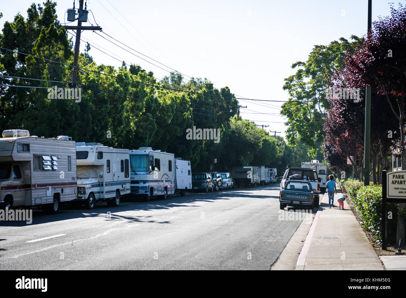 RVs parked along Crisanto Street in Mountain View, California are home