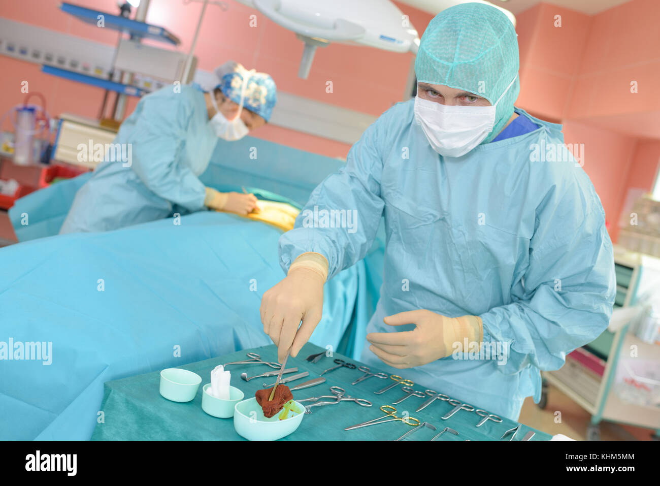 surgeons holding medical instruments Stock Photo Alamy
