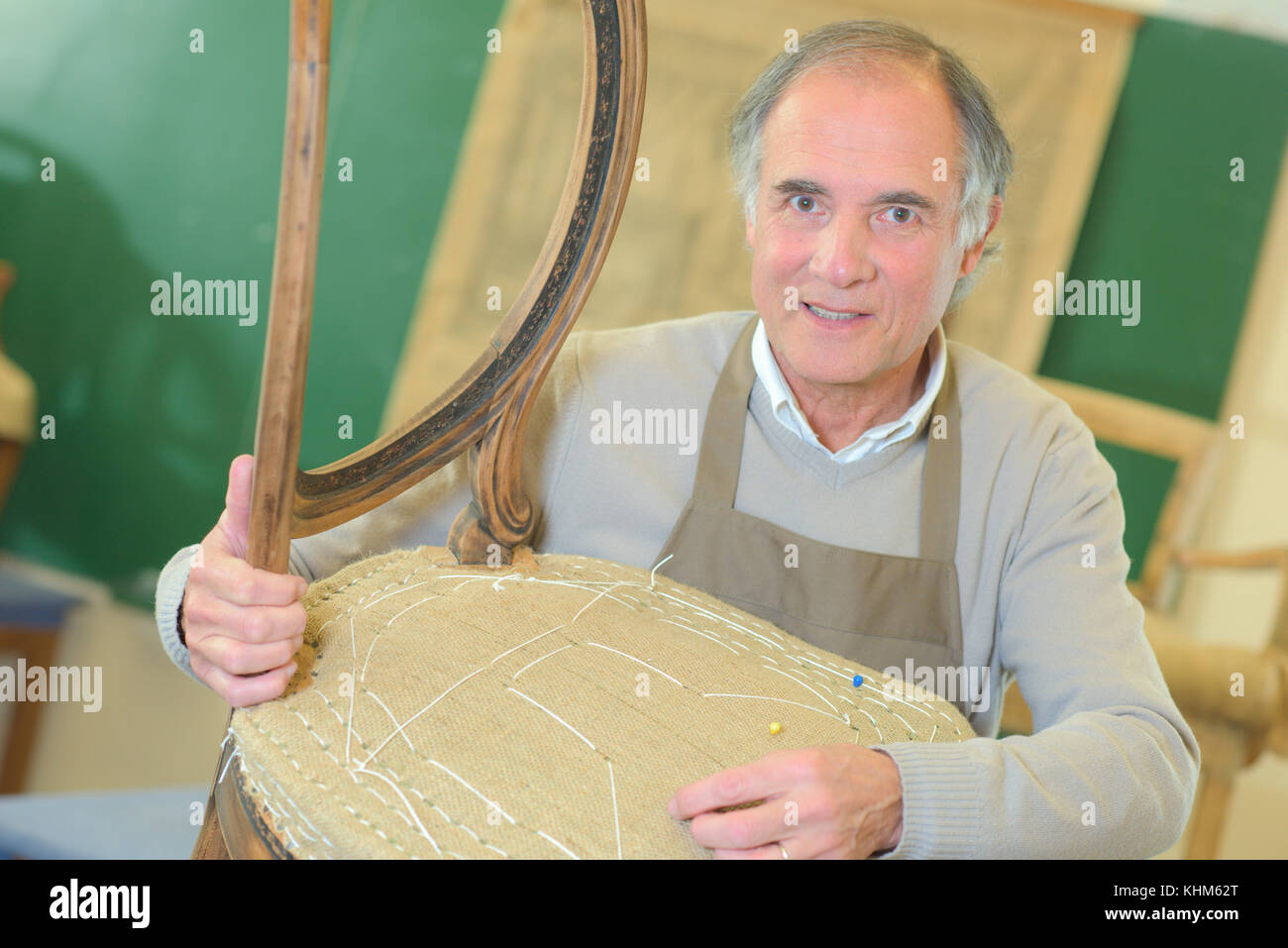 senior craftman fixing a chair Stock Photo Alamy