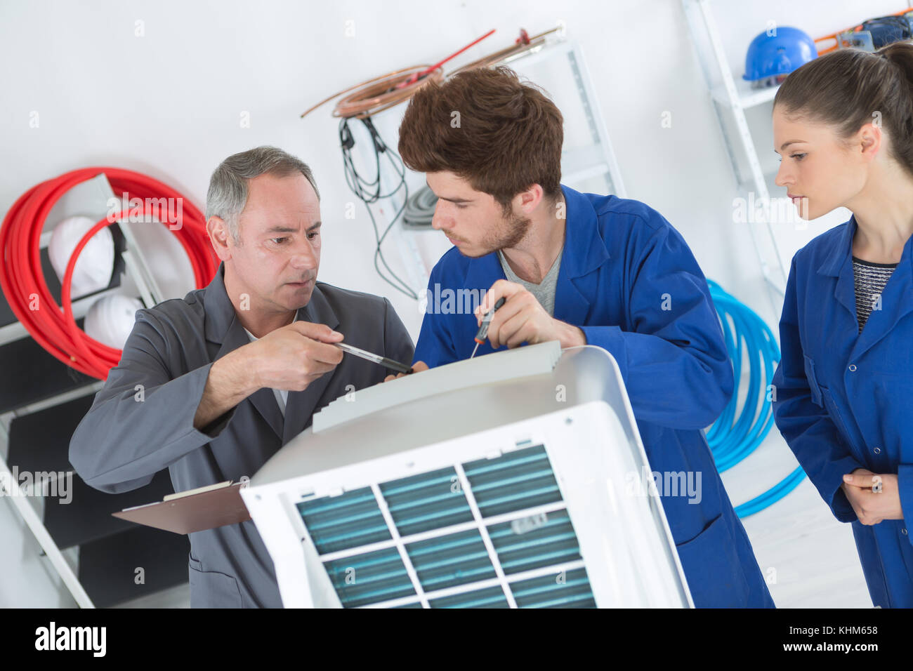 technician is checking air conditioner with apprentices Stock Photo Alamy