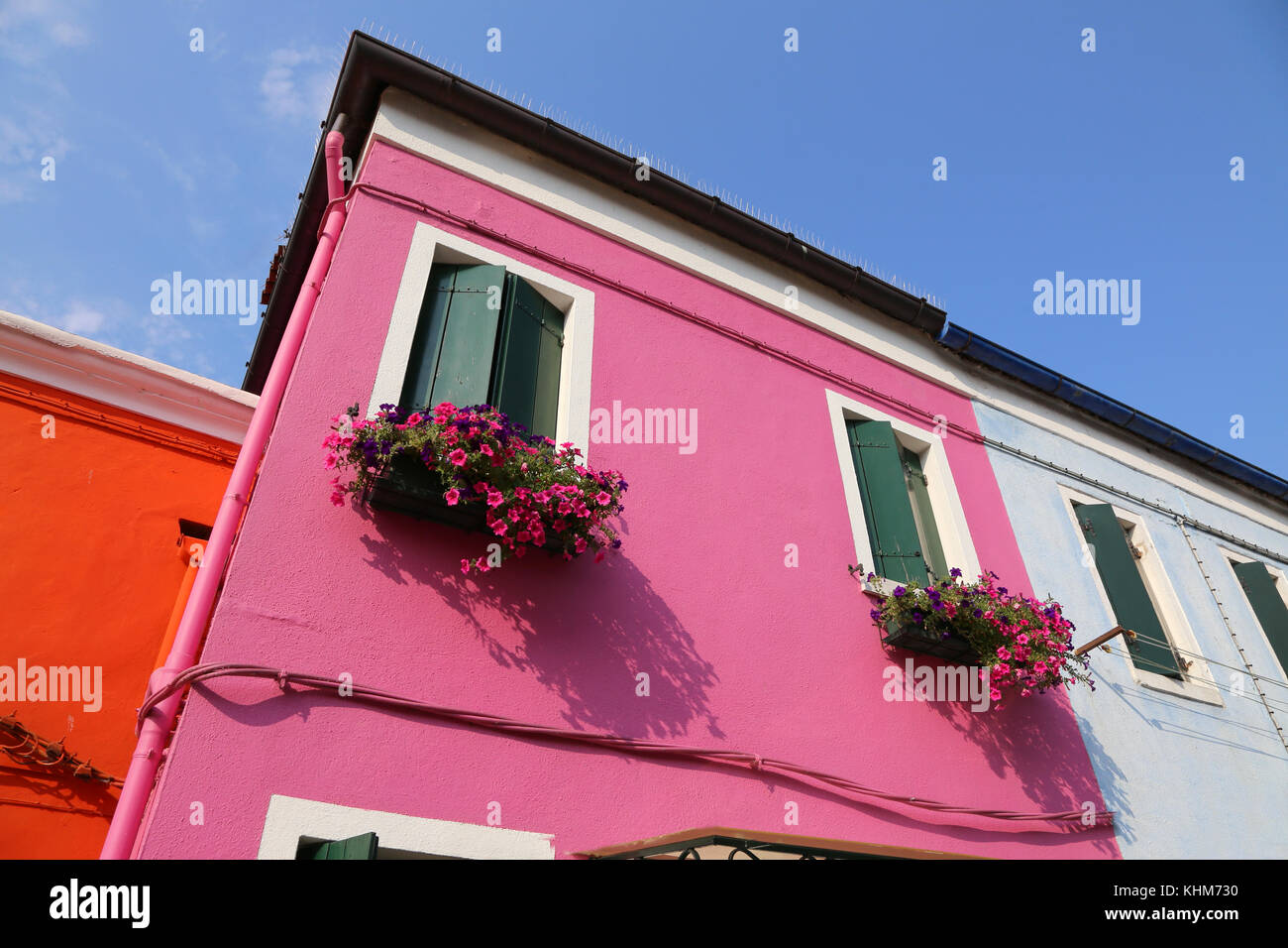 detail of pink house with flowery balcony in the town of Burano Stock Photo