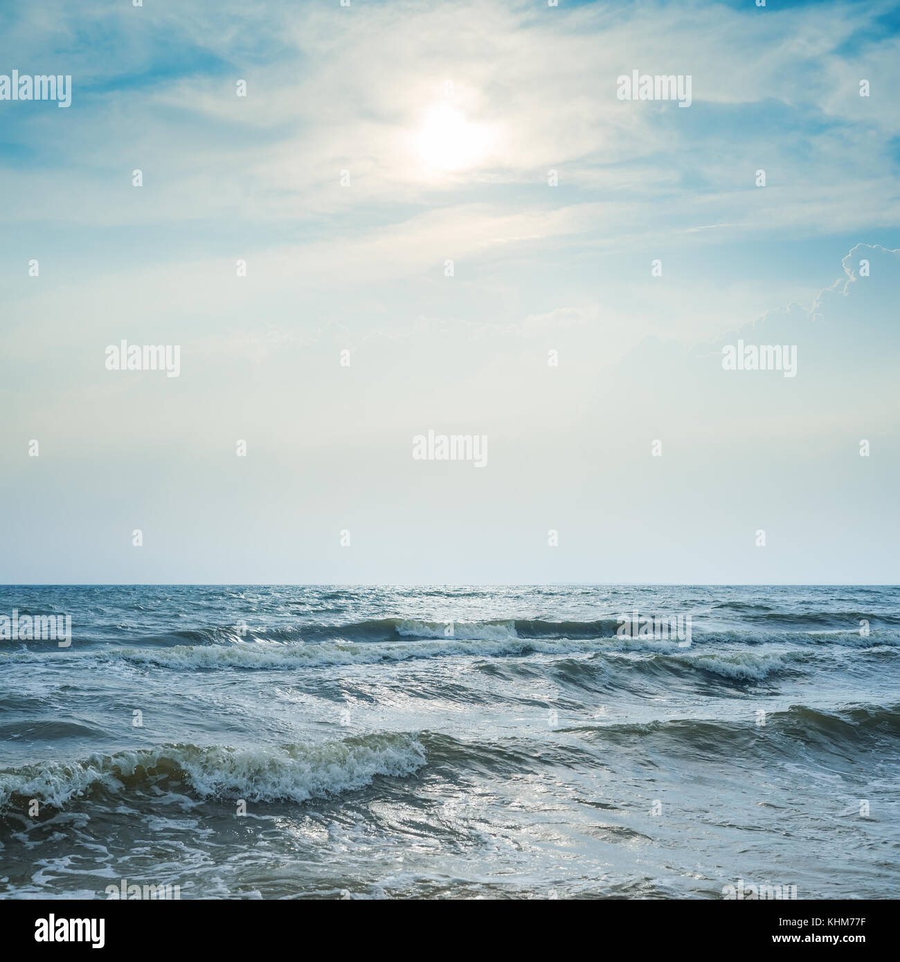 stormy sea and dramatic sky with sun Stock Photo - Alamy