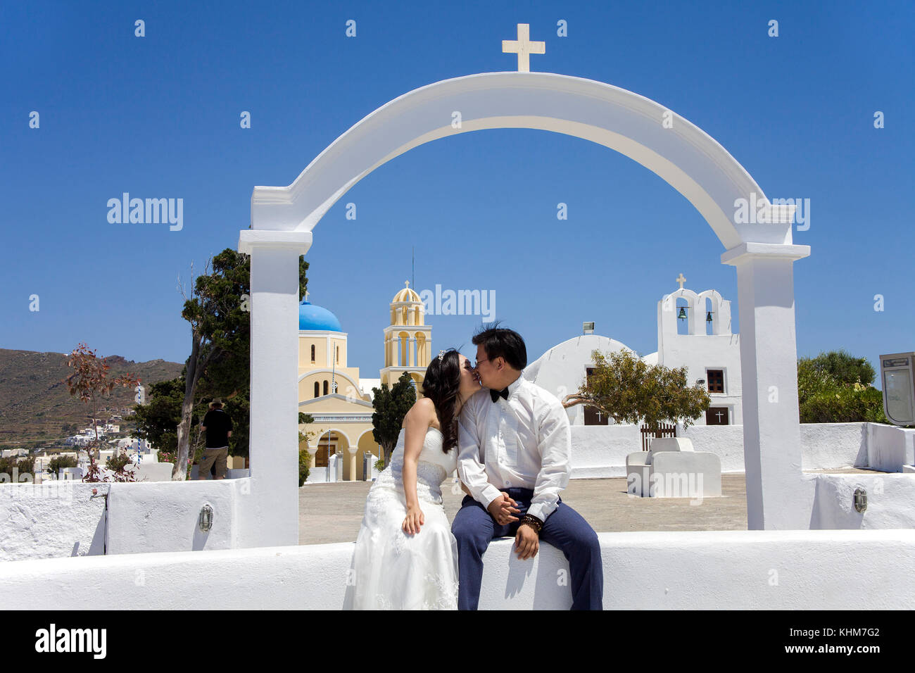 Bridal couple at the orthodox church, Oia, Santorin island, Cyclades, Aegean, Greece Stock Photo