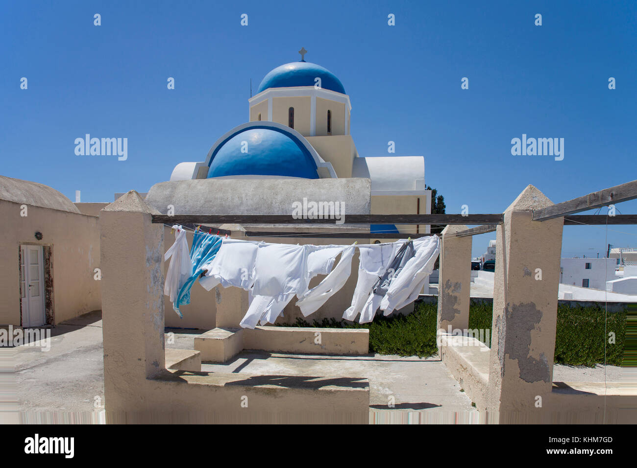 Outhanging laundry at the orthodox church, Oia, Santorin island, Cyclades, Aegean, Greece Stock Photo