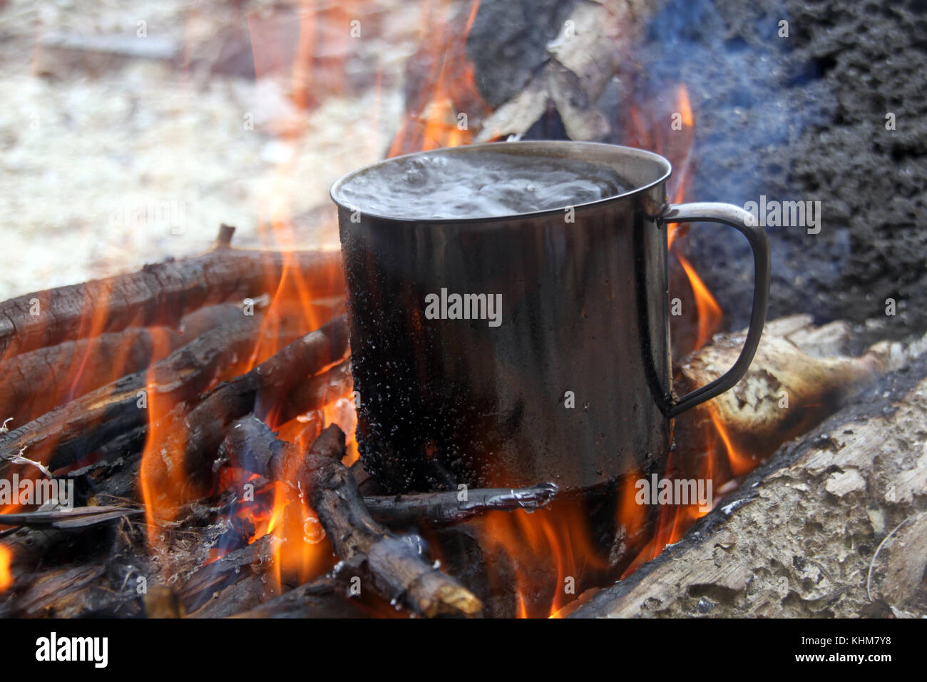 Wood and boiling water in big campfire Stock Photo Alamy