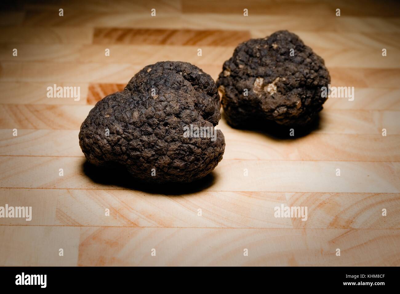 Precious Italian truffles, on a wooden cutting board Stock Photo