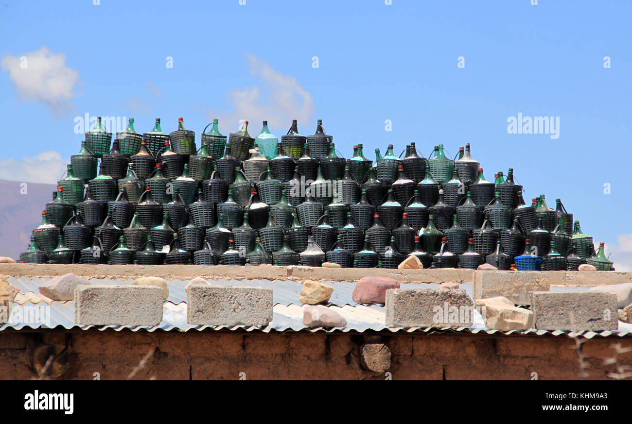 Group of wine bottles on the roof of house in arid climate Stock Photo