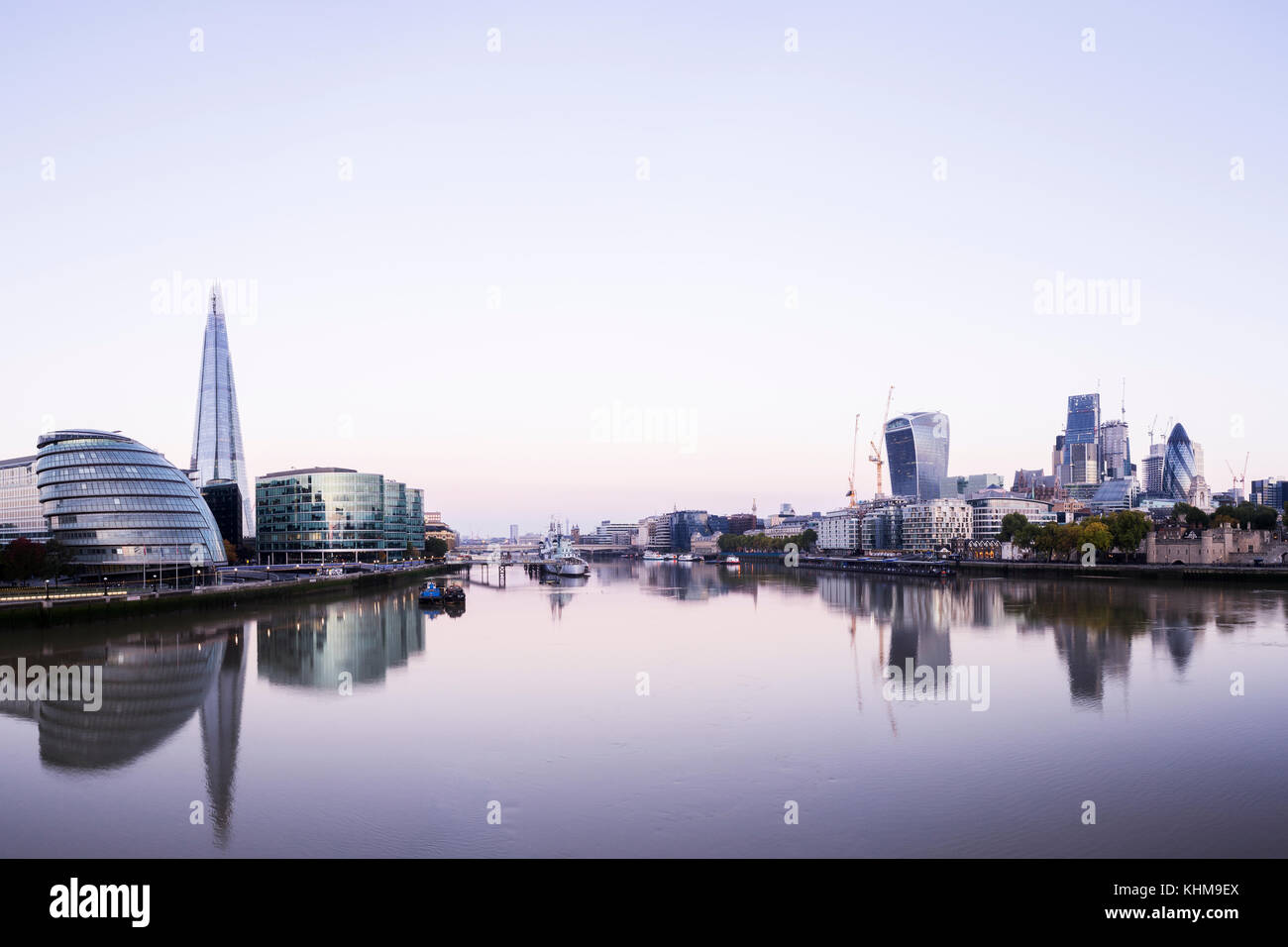 UK, London, City skyline across Thames River with view of the Shard and the financial district at dawn Stock Photo