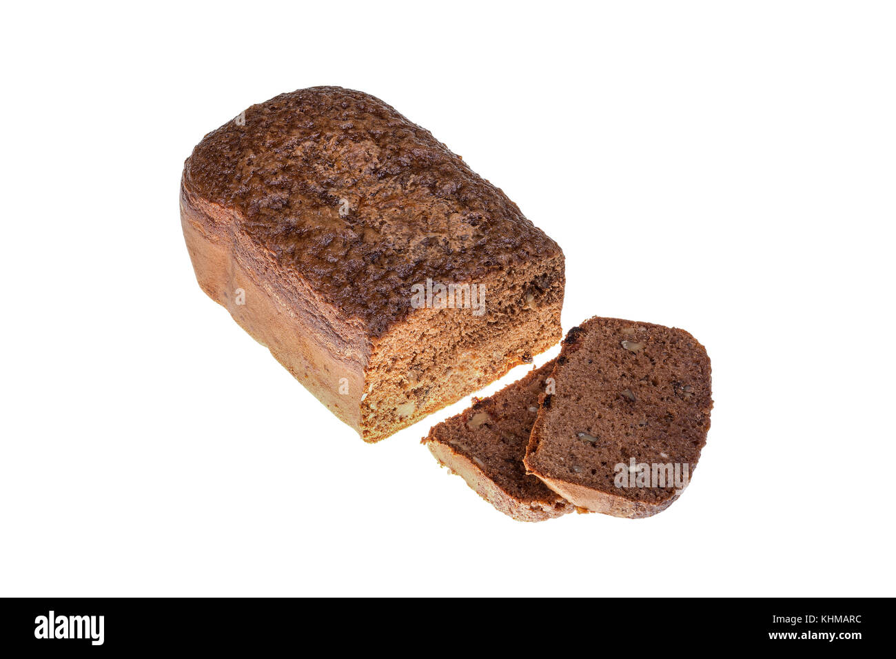 Homemade cocoa cake with walnuts and raisins baked in bread maker isolated on white background. Stock Photo