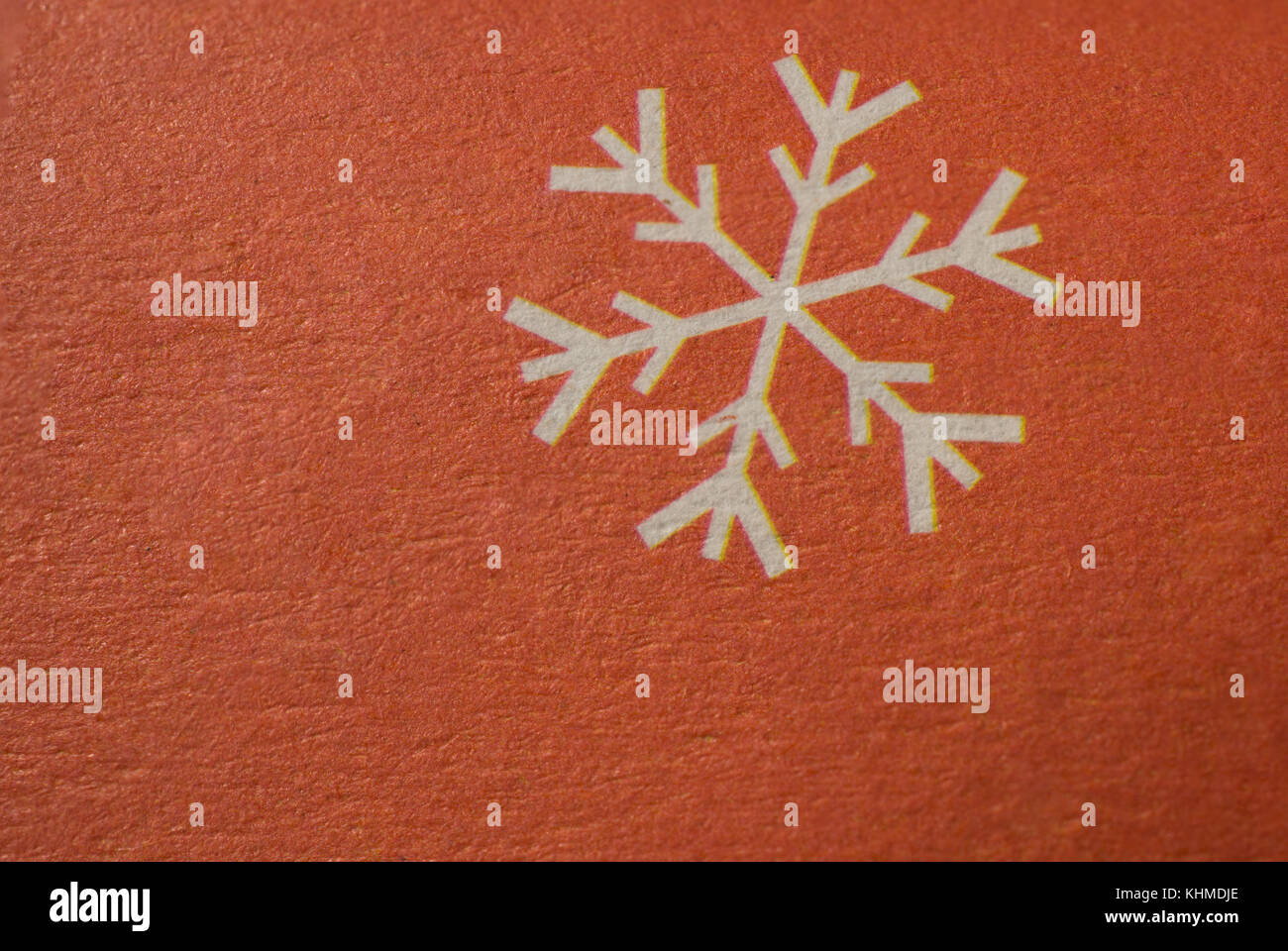 Snowflake - Winter or christmas Symbol on paper macro shot. Stock Photo