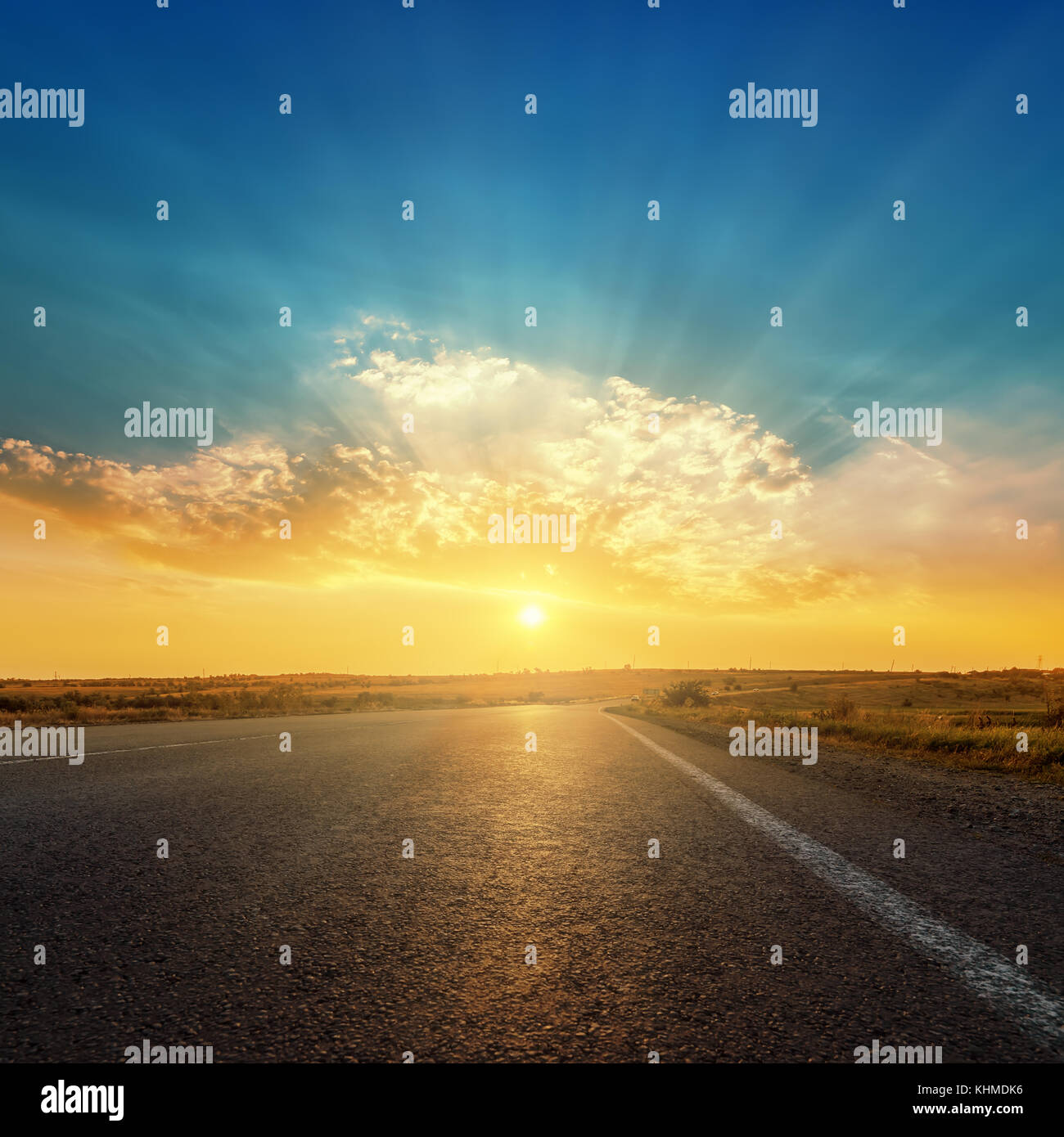 asphalt road and sunset in clouds Stock Photo - Alamy