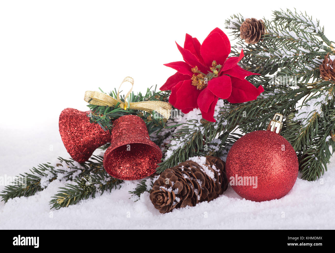 Colorful Christmas decorations in snow with white background Stock Photo
