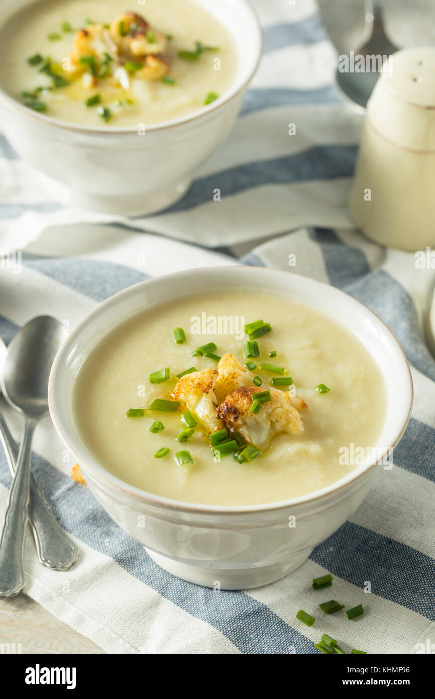 Healthy Homemade Cauliflower Soup with Butter and Chives Stock Photo