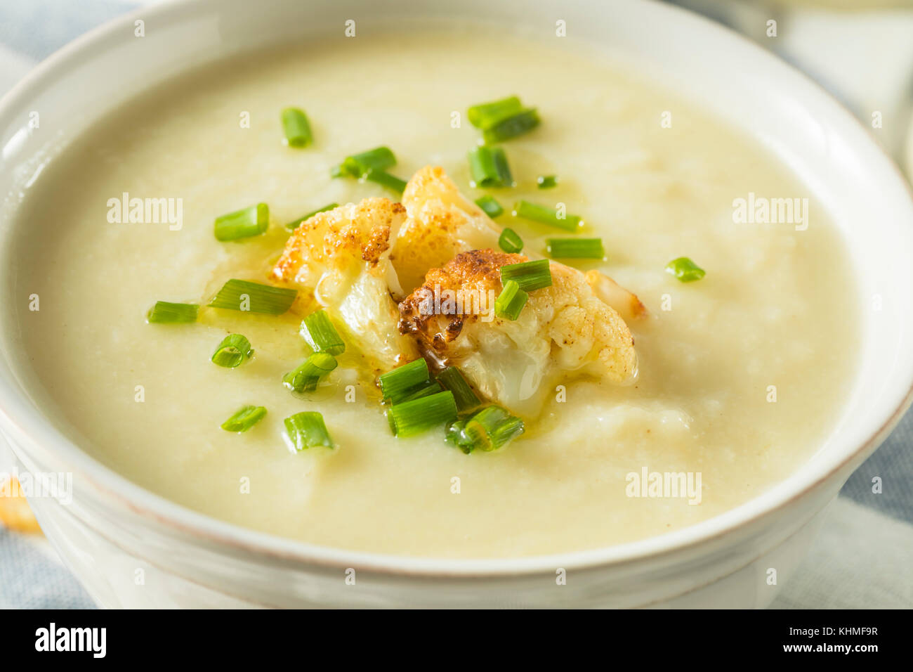 Healthy Homemade Cauliflower Soup with Butter and Chives Stock Photo