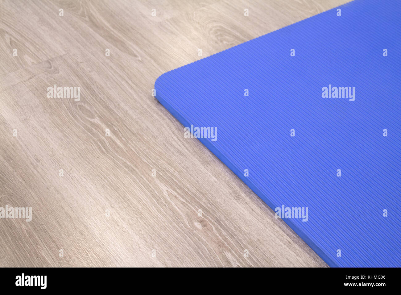 Yoga Mat On Wooden Floor To Perform Meditation Exercises Stock
