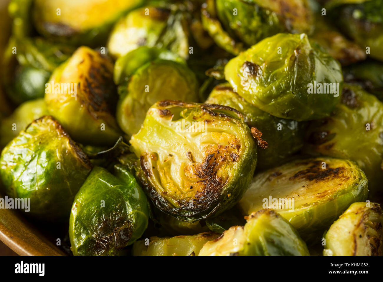 Homemade Roasted Green Brussel Sprouts in a Bowl Stock Photo