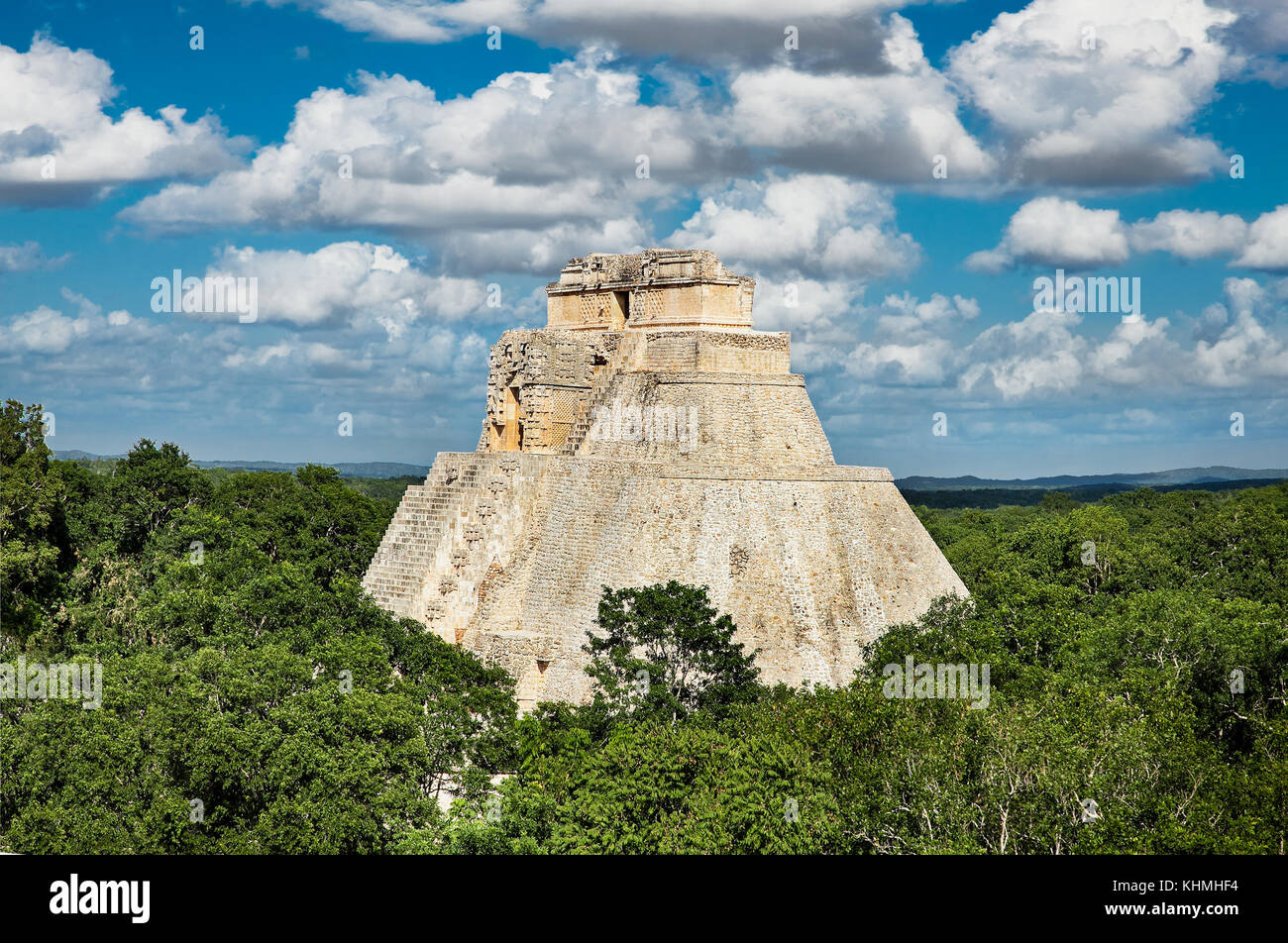Mayan pyramid of the Magician (Piramide del adivino)in the middle of the jungle, Uxmal, Mexico Stock Photo