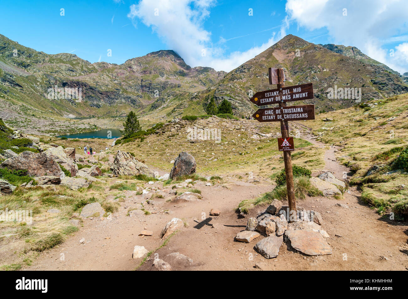 view of high mountain lake called 'Estany del mig' - midle lake with a sign in the foreground,  near Ordino, Tristaina, Andorra Stock Photo