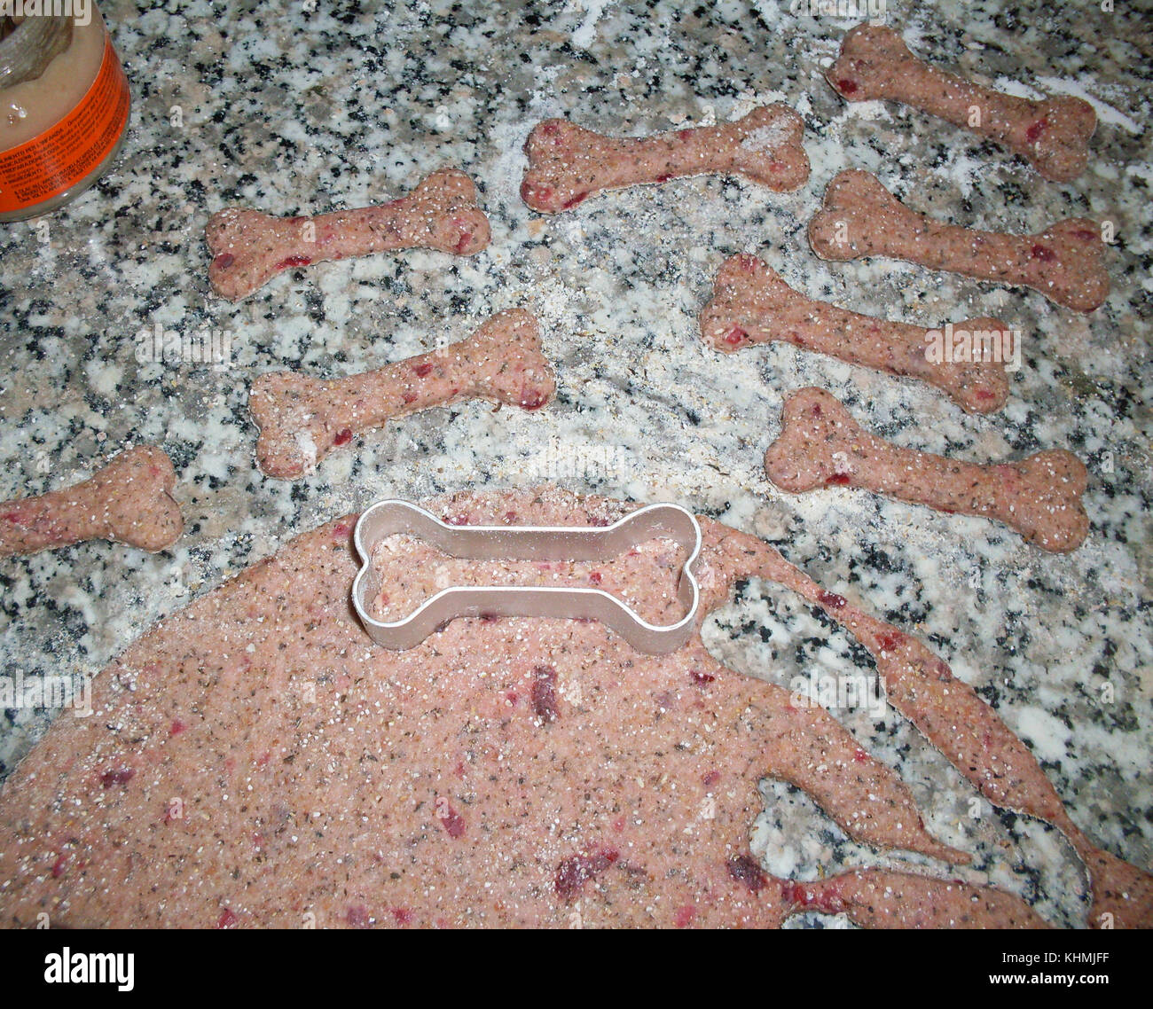 Making homemade dog cookies in the shape of a bone. Stock Photo