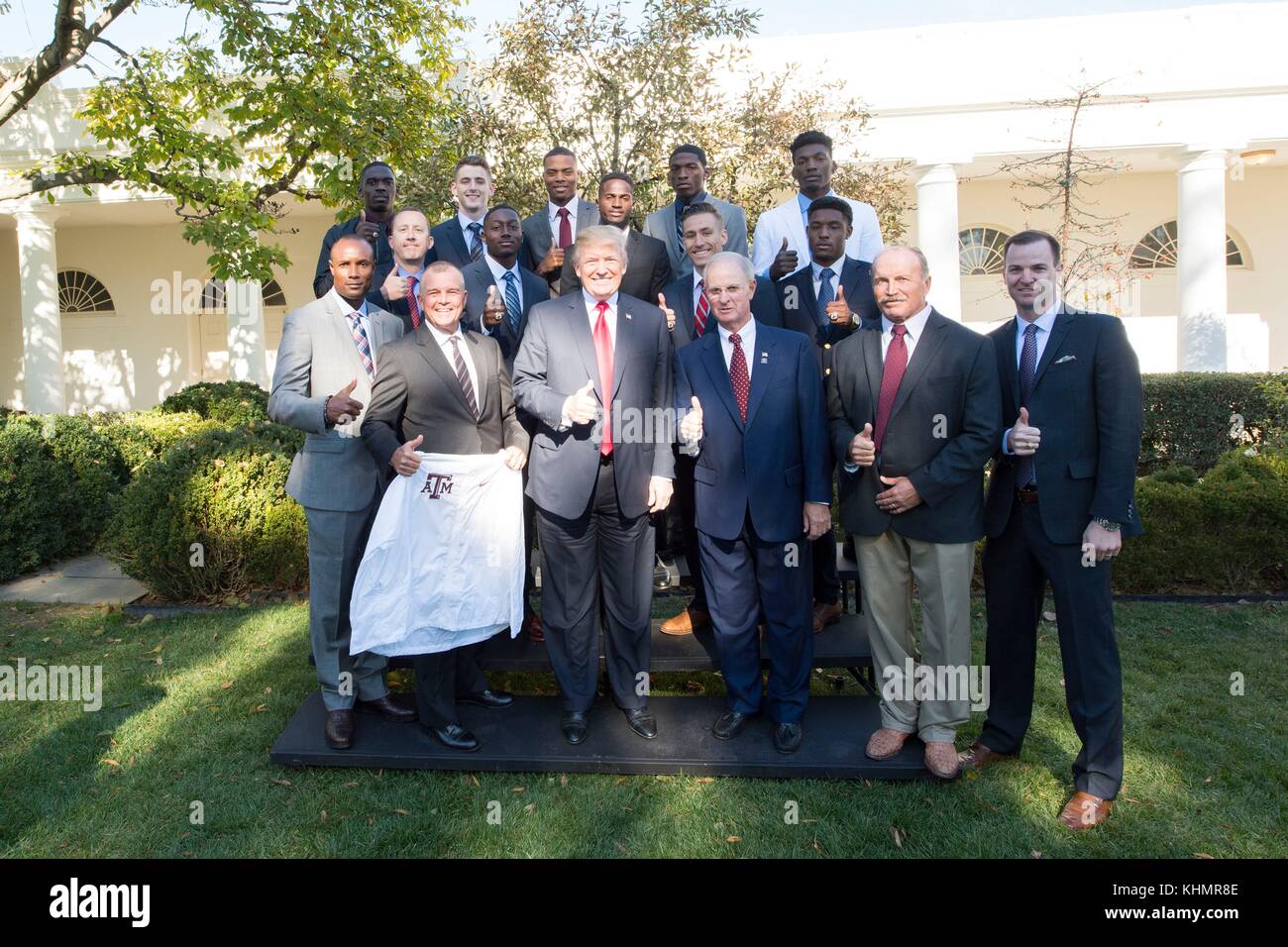 Washington DC, USA. 17th November, 2017. U.S. President Donald Trump poses with the Texas AM Texas University Men's Indoor Track and Field NCAA National Championship Team at the White House November 17, 2017 in Washington, D.C. Credit: Planetpix/Alamy Live News Stock Photo